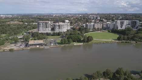 Aerial-drone-shot-over-Cooks-River-in-the-suburb-of-Sydney,-Australia