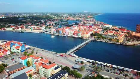 Truck-right-aerial-view-of-the-Otrobanda-and-Punda-districts-of-Willemstad,-Curacao,-Dutch-Caribbean-island-on-a-sunny-day