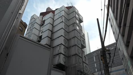 Demolition-works-continue-at-Tokyo's-iconic-Nakagin-Capsule-Tower-in-Ginza-on-April-16,-2022,-in-Tokyo,-Japan