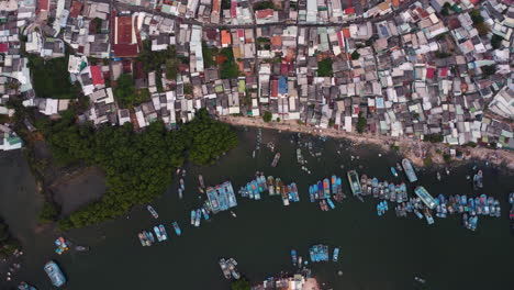 Phan-Thiet-harbor-and-overpopulated-town-in-Vietnam,-aerial-top-down-view