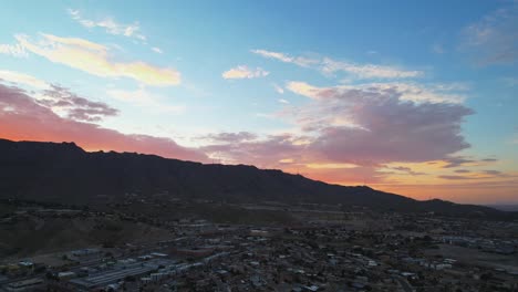 El-Paso,-Texas-During-Beautiful-Colorful-Sunrise-With-Cloudy-Twilight-Sky-And-Franklin-Mountains-In-The-Background