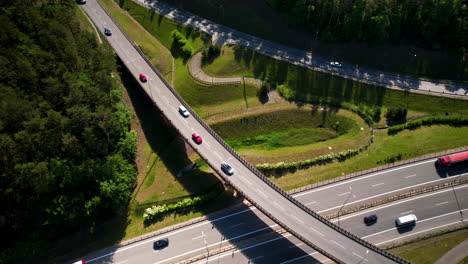 Aerial-View-Of-Vehicles-Driving-Through-E28-And-S26-Road-On-A-Sunny-Day-In-Gdynia,-Poland