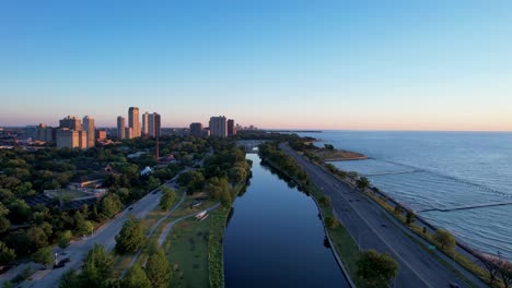 Early-Morning-Sunrise-Over-Waterfront-City-Park-Drone
