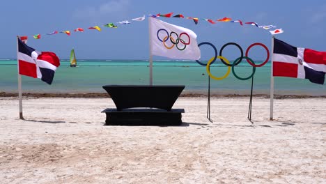 Banderas-De-República-Dominicana,-Olímpicas-E-Internacionales-Ondean-En-Los-Vientos-Alisios-Del-Caribe