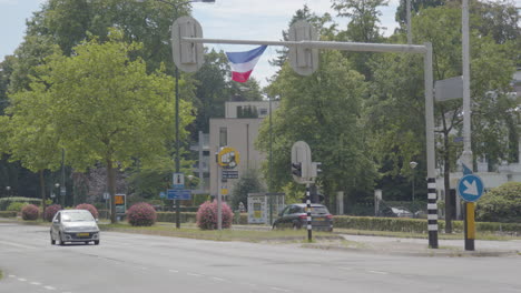 Wide-view-of-Upside-down-Dutch-flag-hanging-on-traffic-light