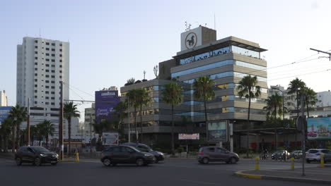 Wide-view-of-the-headquarters-of-the-Central-Popular-Bank-of-Morocco-with-car-traffic-in-front