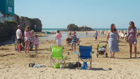 Young-And-Adult-People-Spending-Their-Summer-Holidays-At-Perran-Sands-Beach-In-Cornwall,-England,-UK