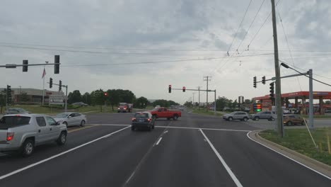 Traveling-in-the-Chicago-Illinois-area,-suburbs,-streets,-and-highways-in-POV-mode-silver-suv-passing-by