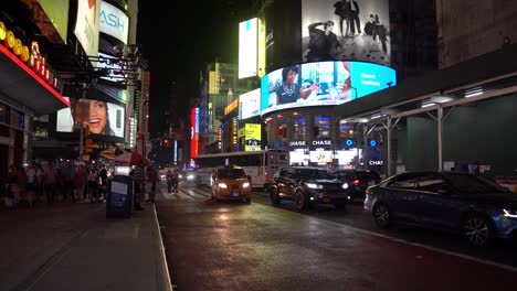 Slow-motion-footage-of-crowds-and-traffic-at-Times-Square-at-night