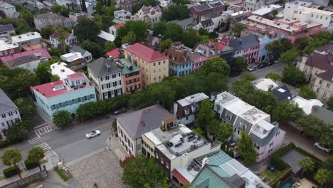 An-overhead-tracking-drone-shot-of-Rainbow-Row-in-Charleston,-SC