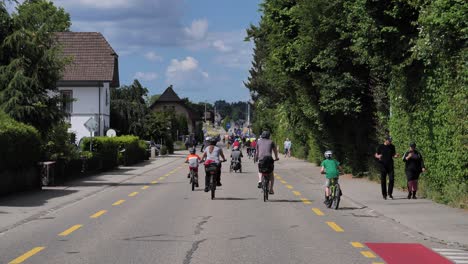 Pov-ride-on-bike-on-street-in-switzerland-during-slowup-event-without-cars-on-road