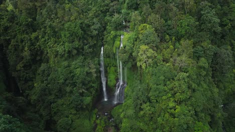 Sekumpul-Triple-Waterfalls-in-lush-moody-tropical-jungle,-paradise-in-nature,-aerial
