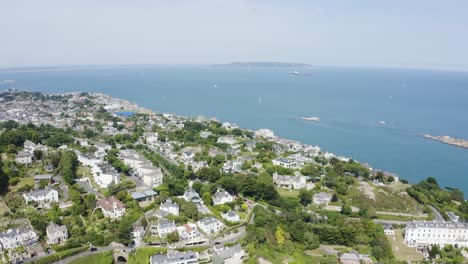 Flying-over-The-Dalkey-Town-with-The-Dalkey-Island-and-yachts-in-the-distance,-Ireland