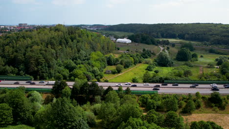 Aerial-panning-shot-of-cars-are-stuck-in-traffic-in-scenic-landscape-during-summer-season---Holiday-start-in-Poland