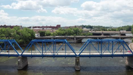 Grand-Rapids,-Michigan-blue-pedestrian-bridge-close-up-moving-up