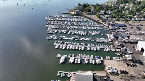 An-aerial-view-over-a-marina-on-a-sunny-day-in-Norwalk,-CT