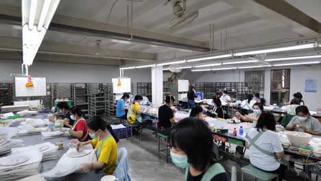 Asian-Workers-Working-in-Ceramic-Factory,-Wide-Shot