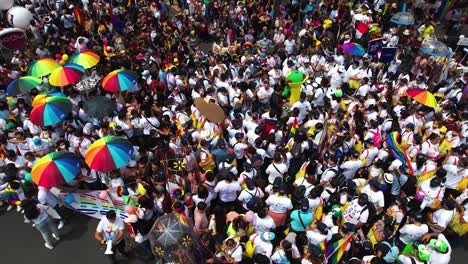 Aerial-view-overlooking-an-enormous-group-of-people-celebrating-diversity-and-human-rights-on-a-city-streets