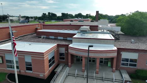 Entrance-to-school-building-and-flagpole