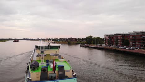 Aerial-Circle-Dolly-Around-Stern-Of-Ellen-Liquid-Tanker-Along-River-Noord