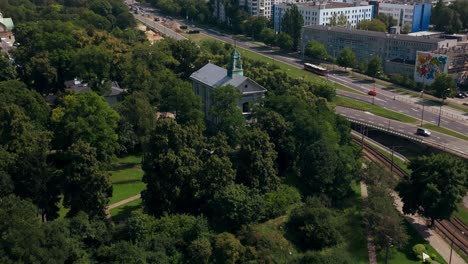 Warsaw,-Poland,-Aerial-View-of-Street-Traffic-in-Western-Wola-District-With-Downtown-Skyscrapers-in-Background,-Revealing-Drone-Shot