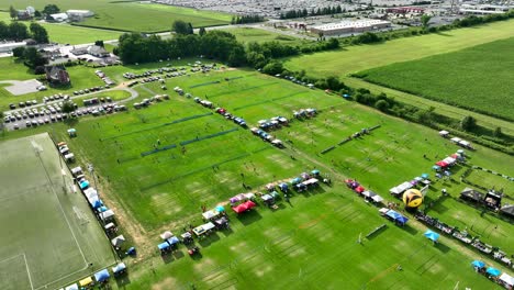 High-aerial-reveal-of-massive-grass-volleyball-tournament