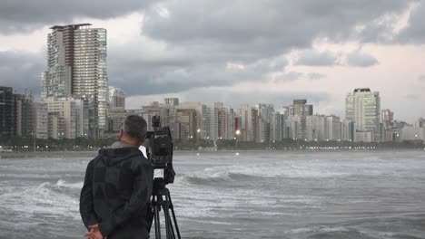 Brazilian-press-journalist-films-cityscape-of-Santos-during-high-tide-sea-level
