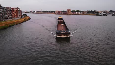 Nice-Shot-Of-Candesso-Cargo-Ship-Changing-Direction-Towards-Port-Shore,-Netherlands