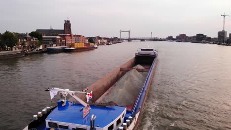 Aerial-drone-shot-over-Insomnia-Cargo-ship-in-Dordrecht,-Netherlands-during-evening-time