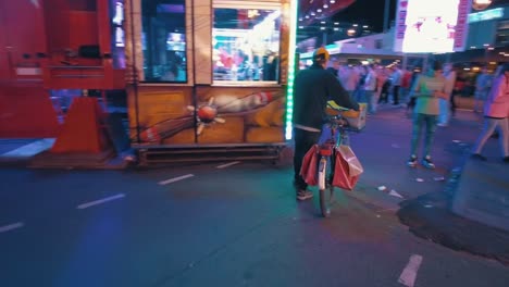 poor-elderly-man-with-bicycle-turns-around-and-walks-back-into-the-fun-fair
