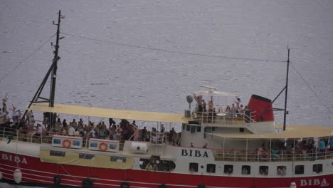 Biba-Party-Ship-Sailing-on-the-Adriatic-Sea-at-the-shore-of-Brela,-Croatia