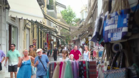People-walking-down-a-busy-greek-market-street-in-Athens