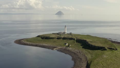 Aerial-view-of-Pladda-Lighthouse-on-the-Isle-of-Arran-on-a-sunny-day,-Scotland