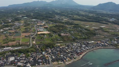 Aerial-Tilt-Reveal-of-Mikuriya-Town-and-Mt-Daisen,-Tottori-Prefecture,-Japan