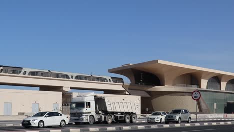 A-view-of-Metro-train-through-flyover-above-the-highway-departing-from-a-station