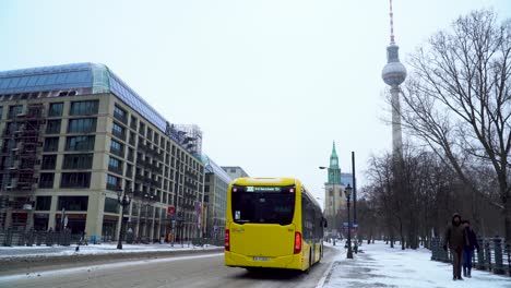 Urban-Traffic-Scenery-on-Snowy-Street-of-Berlin-next-to-Alexanderplatz
