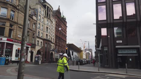 People-crossing-the-road-in-a-quiet-city-centre-during-the-coronavirus-lockdown