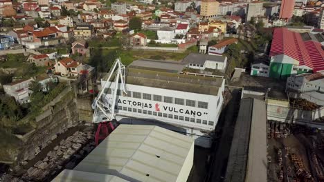 Aerial-view-at-sunset-of-the-old-shipyard-Factorias-Vulcano-in-Teis,-Vigo