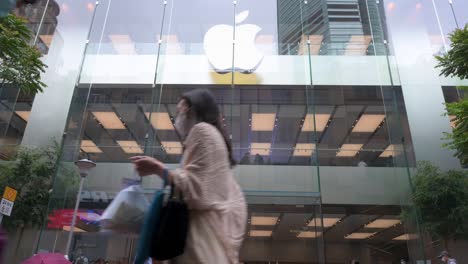 People-walk-past-the-American-multinational-technology-brand-Apple-official-store-seen-in-Hong-Kong