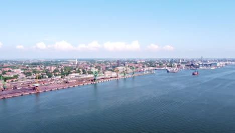 Klaipeda-industrial-harbor-and-city-skyline-in-vibrant-aerial-drone-view