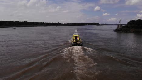 Aerial-View-Of-Patrol-Boat-From-Rijkswaterstaat-Navigating-Along-Oude-Maas