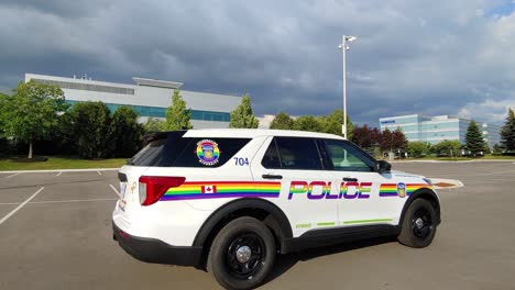 A-Peel-Regional-Police-gay-pride-LGBTQ-month-celebration-car-driving-slowly-at-a-parking-lot