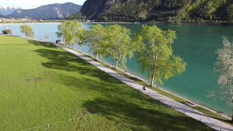 Biking-next-to-beautiful-Achen-lake-surrounded-by-astonishing-mountains