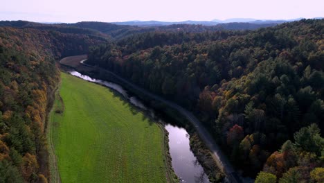 aerial-tilt-up-from-the-new-river-near-west-jefferson-and-jefferson-nc-in-fall-in-the-blue-ridge-and-appalachian-mountains