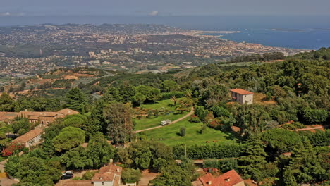 Tanneron-France-Aerial-v27-circular-pan-around-hillside-estates-and-plantation-at-les-plaines,-capturing-beautiful-mountainous-landscape-and-distance-blue-mediterranean-sea---July-2021