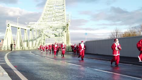 Slow-motion-Charity-Santa-dash-fitness-fun-run-across-Runcorn-Silver-Jubilee-bridge