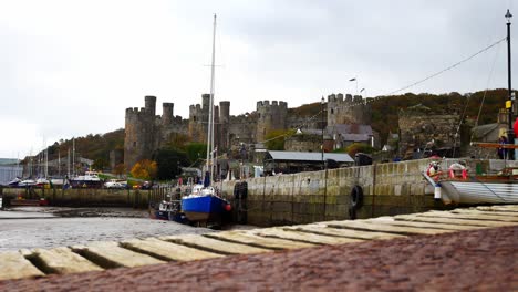 Touristic-Conwy-harbour-and-castle-market-town-North-Wales-coastal-Welsh-waterfront-seaside-attraction-dolly-right