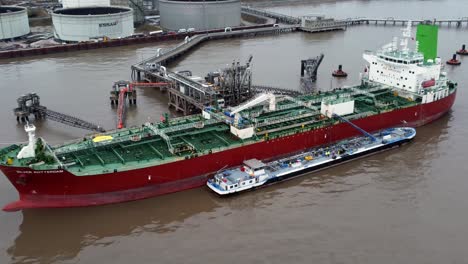 Silver-Rotterdam-chemical-oil-tanker-ship-loading-at-Tranmere-terminal-Liverpool-aerial-view-zoom-in