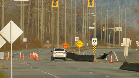 Highway-road-concrete-sheared-apart-and-raised-from-water-flowing-underneath---Flood-aftermath-Damage-on-Highway-11-in-Abbotsford,-BC,-Canada