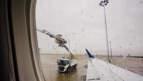 De-Icing-Truck-Arm-Swings-Into-Position-Before-Spraying-Wing-For-Ice-Removal